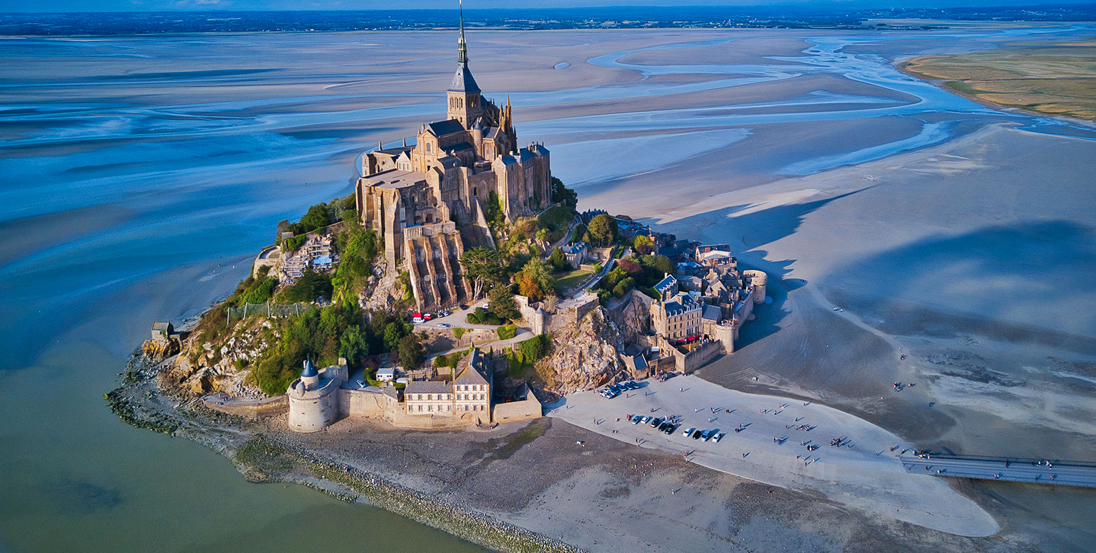 Mont Saint-Michel Abbey at high tide - luxury Paris to Mont Saint-Michel private transfer with comfortable Mercedes vehicles